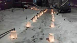 candles in bags on sidewalk
