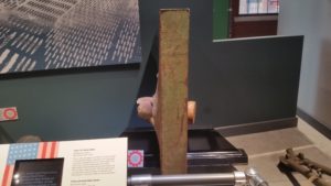 thick steel plate with artillery stuck in it