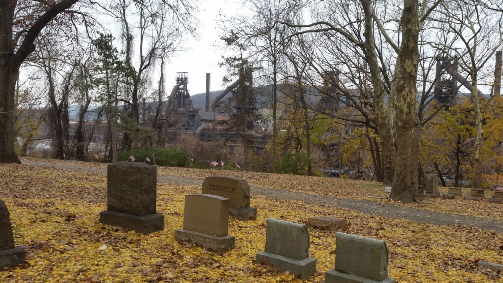 cemetery scene with industry in background