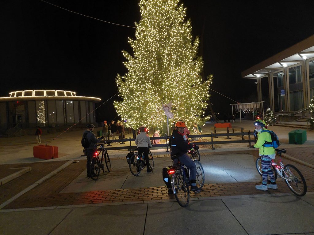 outdoor Christmas tree with bicyclists